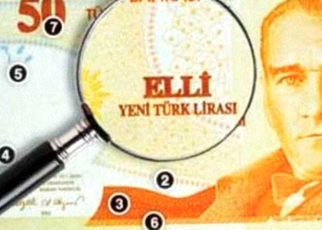Parann n yznde yer alan Atatrk portresinin yan sra Trkiye Cumhuriyeti Merkez Bankas ve banknotun deerini gsteren saylar da dahil olmak zere yazlarda kabartma bask bulunur. rnein fotorafta grld gibi 50 TL